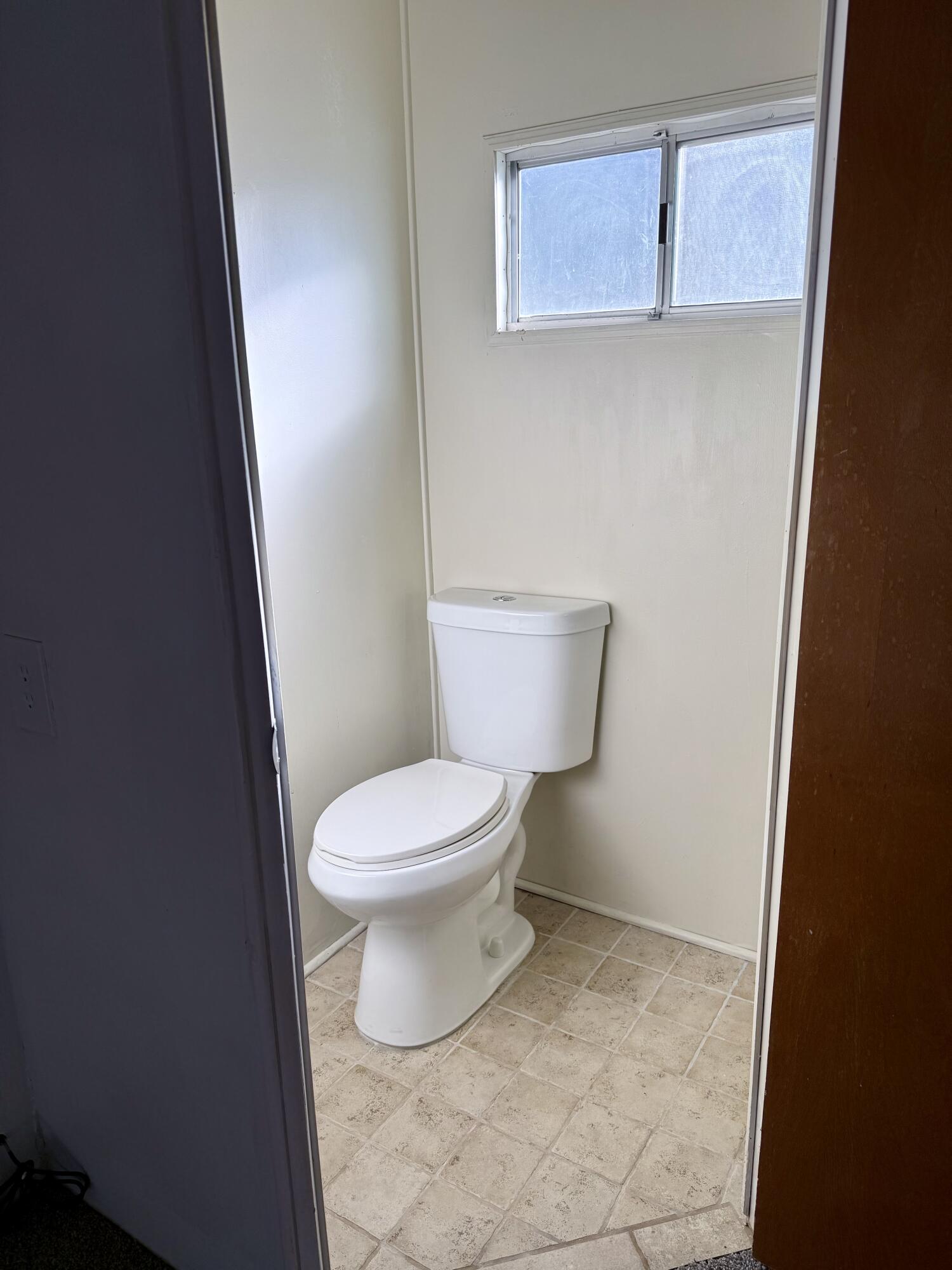 22 Jupiter Street Palm Springs, CA 92264 - Photo 30 of 35 a white toilet sitting next to a shower in a bathroom