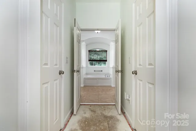a view of a bathroom from a hallway