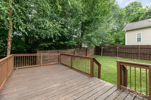 a view of deck with wooden floor and fence