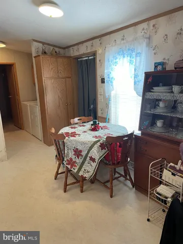 a bedroom with a bed a table and chair