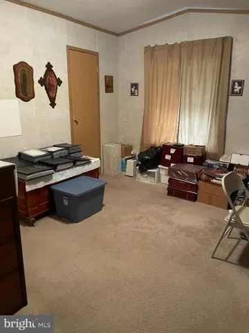 a room with a bed and furniture