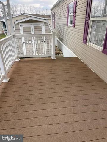 a view of a brick house with many windows