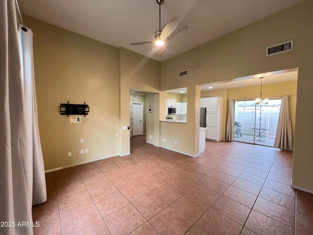 a view of a hallway with wooden shelves