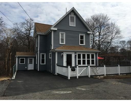 a front view of a house with entrance gate