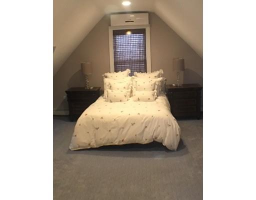 12 Johnston Terrace Saugus, MA 01906 - Photo 12 of 24 a large bed sitting in a bedroom next to a window