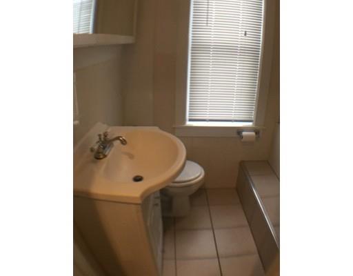 12 Johnston Terrace Saugus, MA 01906 - Photo 18 of 24 a bathroom with a sink a toilet and a window