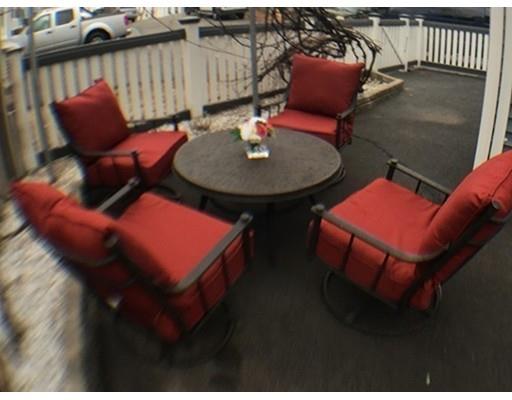 12 Johnston Terrace Saugus, MA 01906 - Photo 20 of 24 a balcony with table and chairs