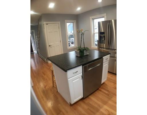 12 Johnston Terrace Saugus, MA 01906 - Photo 3 of 24 a kitchen with a sink and refrigerator