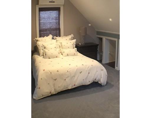 12 Johnston Terrace Saugus, MA 01906 - Photo 6 of 24 a bed sitting in a bedroom next to a window