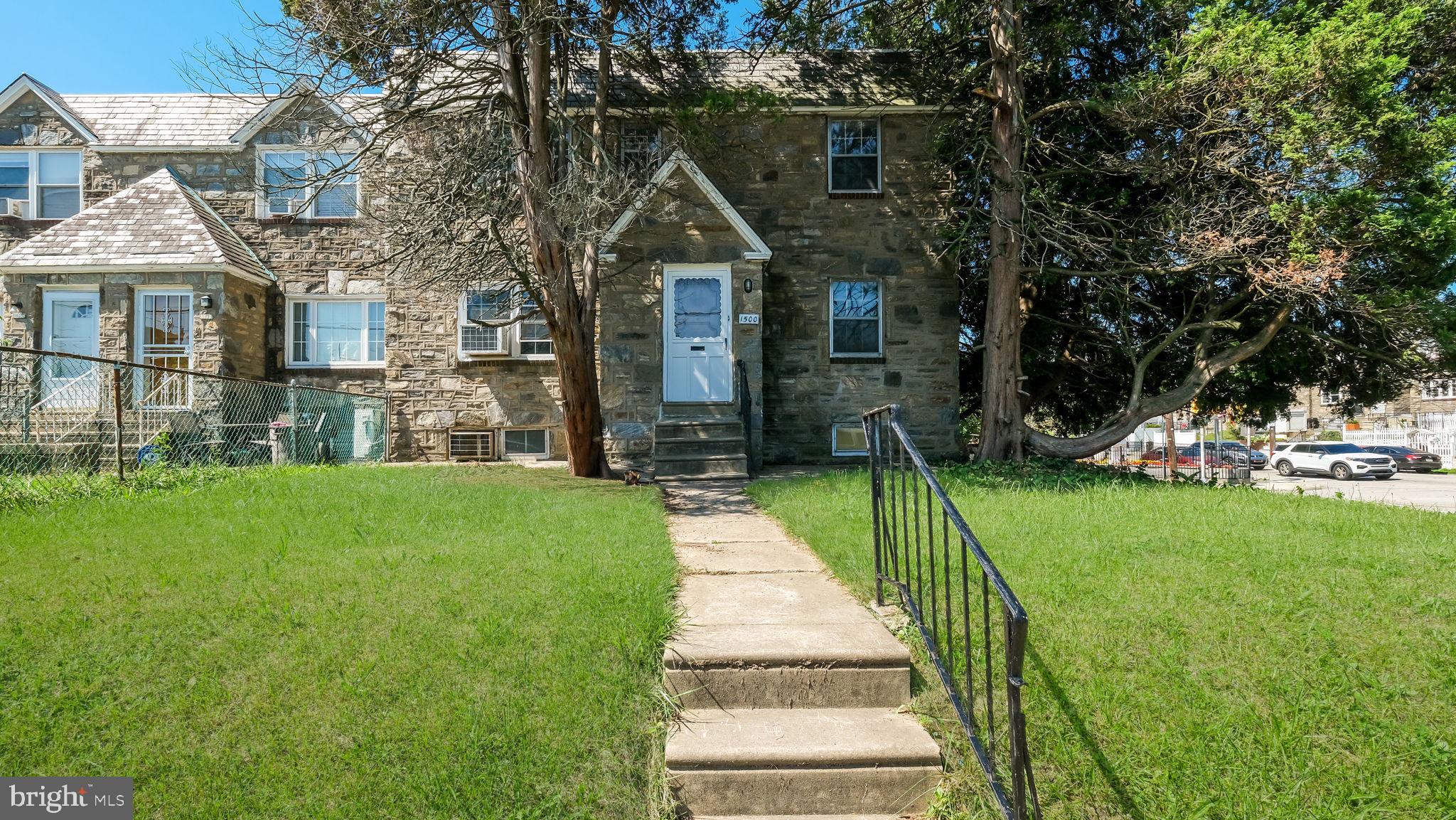 1500 Hellerman Street Philadelphia, PA 19149 - Photo 1 of 31 a front view of a house with a yard
