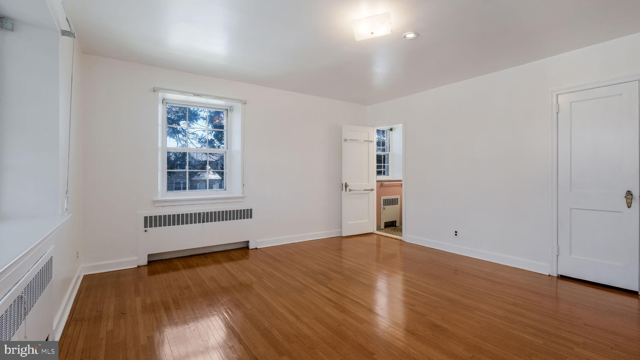 1500 Hellerman Street Philadelphia, PA 19149 - Photo 19 of 31 an empty room with wooden floor and window