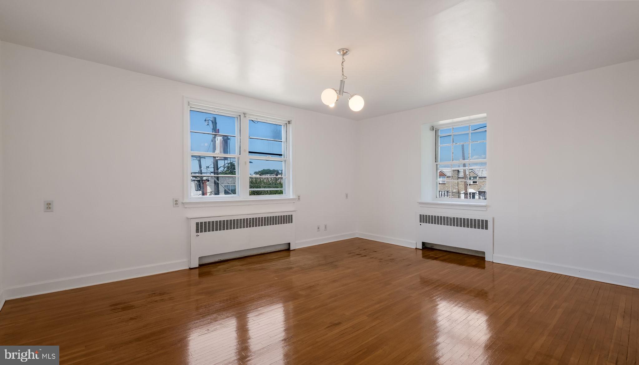 1500 Hellerman Street Philadelphia, PA 19149 - Photo 21 of 31 an empty room with wooden floor and windows