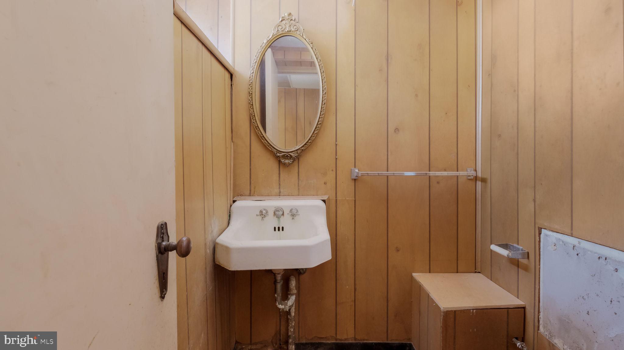 1500 Hellerman Street Philadelphia, PA 19149 - Photo 24 of 31 a bathroom with a sink a mirror and a shower curtain