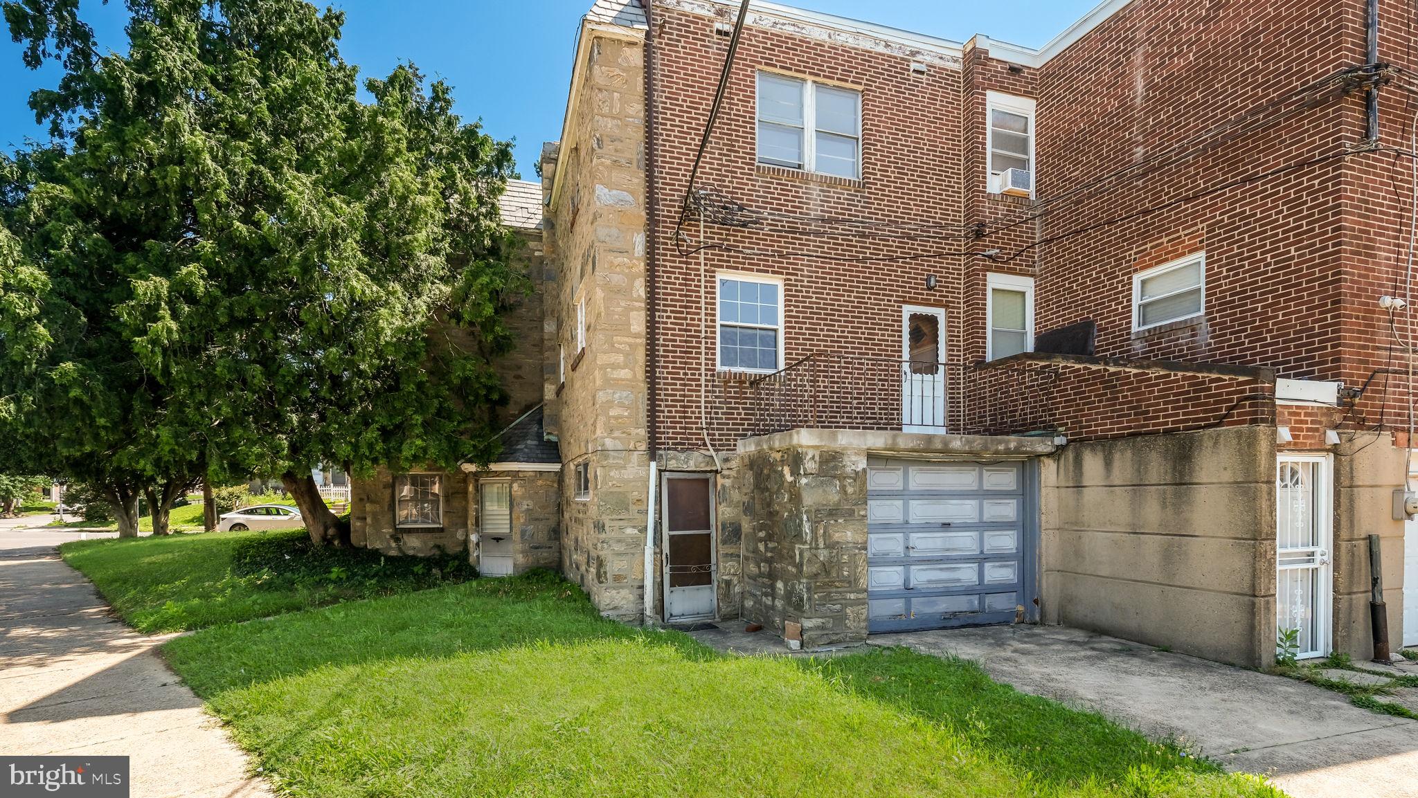 1500 Hellerman Street Philadelphia, PA 19149 - Photo 3 of 31 a brick house with a large tree
