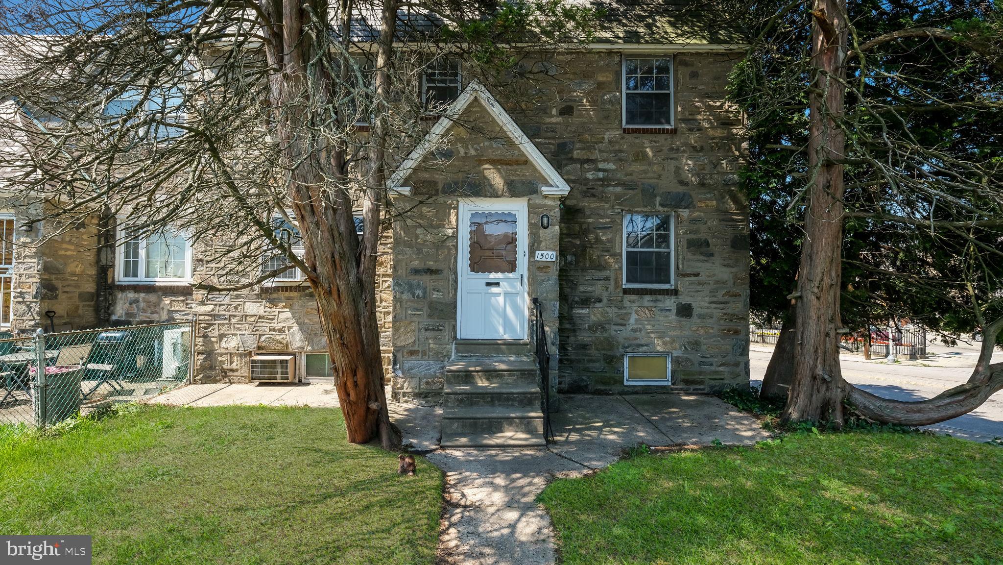 1500 Hellerman Street Philadelphia, PA 19149 - Photo 5 of 31 a front view of a house with a yard