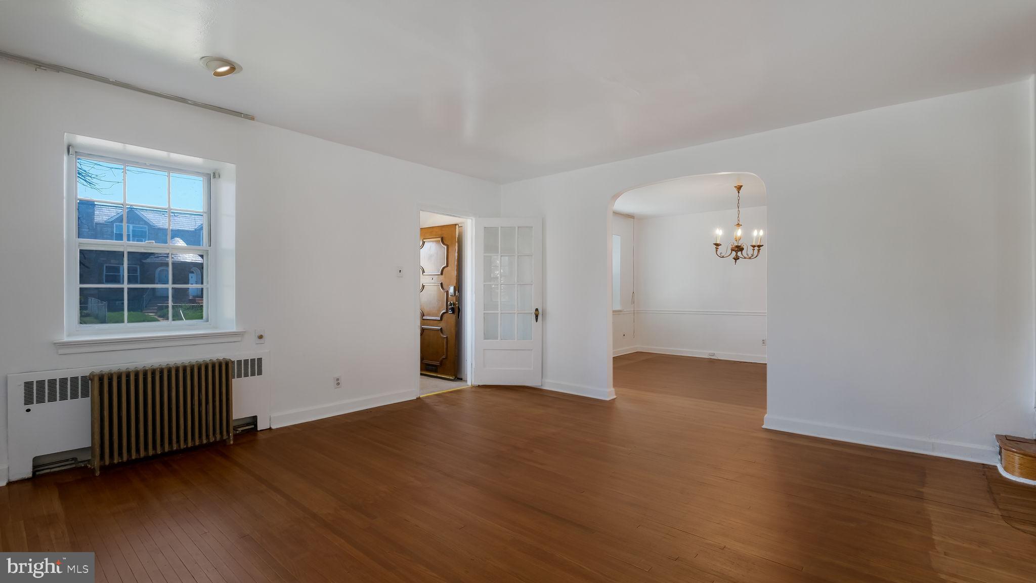 1500 Hellerman Street Philadelphia, PA 19149 - Photo 9 of 31 an empty room with wooden floor and windows
