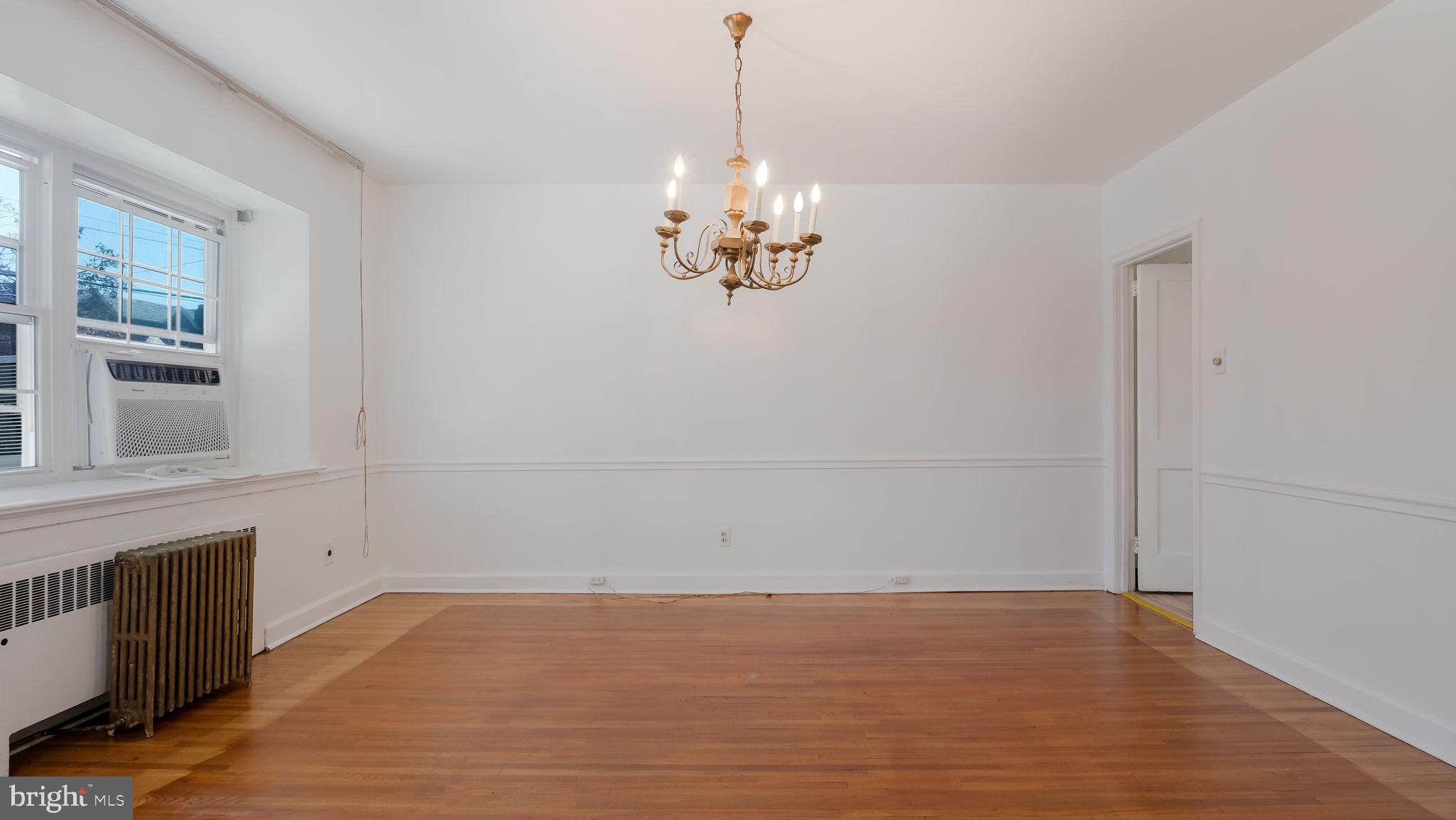 1500 Hellerman Street Philadelphia, PA 19149 - Photo 10 of 31 a view of an empty room with chandelier fan and wooden floor