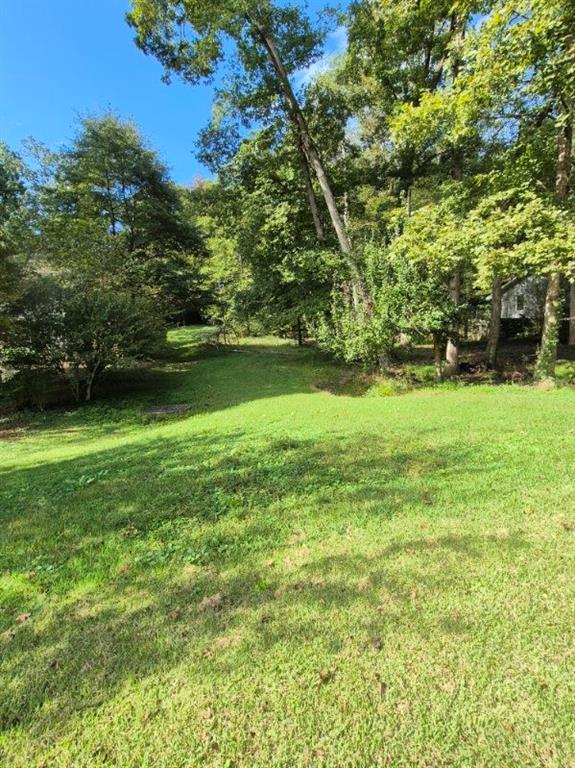 577 Dorsey Circle Southwest Lilburn, GA 30047 - Photo 1 of 3 a view of a green yard