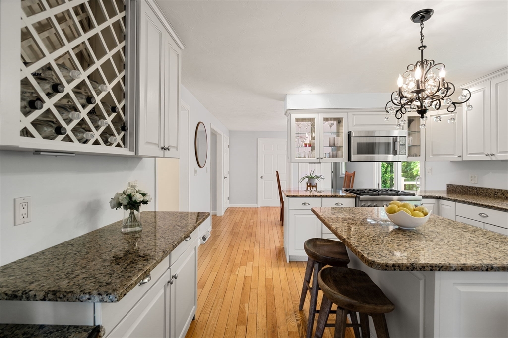 11 Cow Hill Road Sharon, MA 02067 - Photo 10 of 30 a kitchen with a sink a stove and chairs