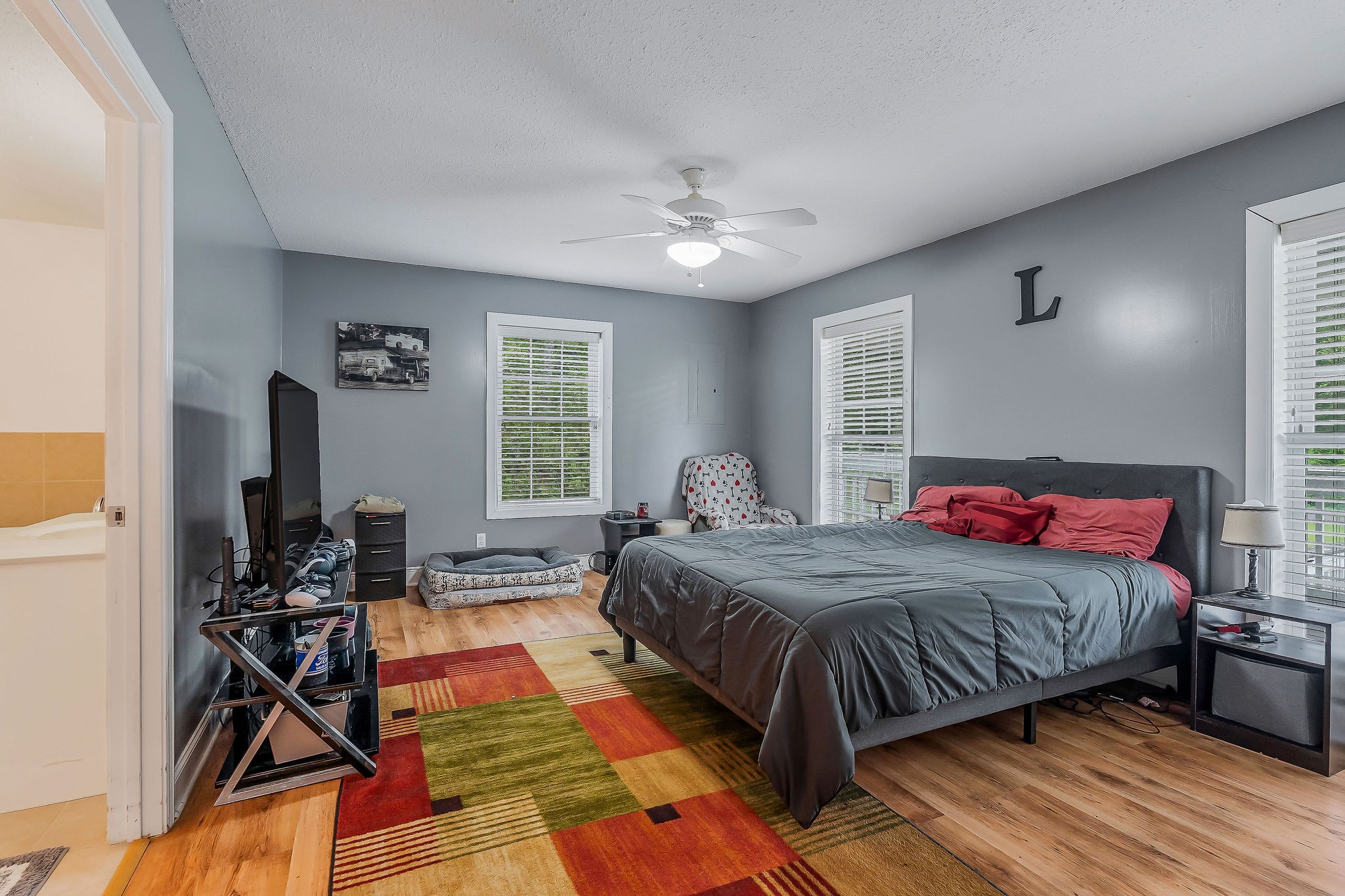 341 Pumpkin Hollow Road Liberty, TN 37095 - Photo 15 of 52 a bedroom with a bed and wooden floor