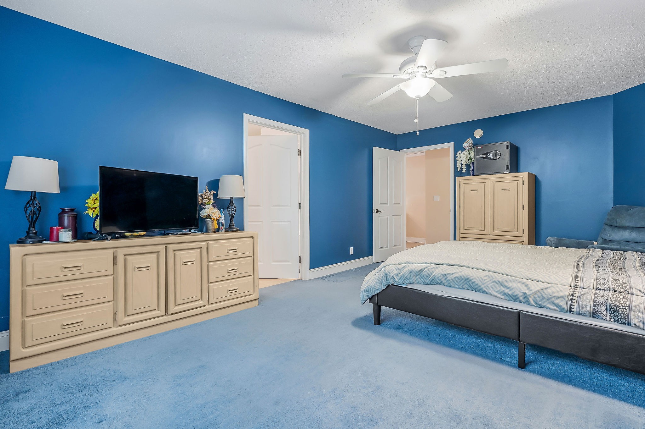 341 Pumpkin Hollow Road Liberty, TN 37095 - Photo 21 of 52 a spacious bedroom with a bed and a flat screen tv