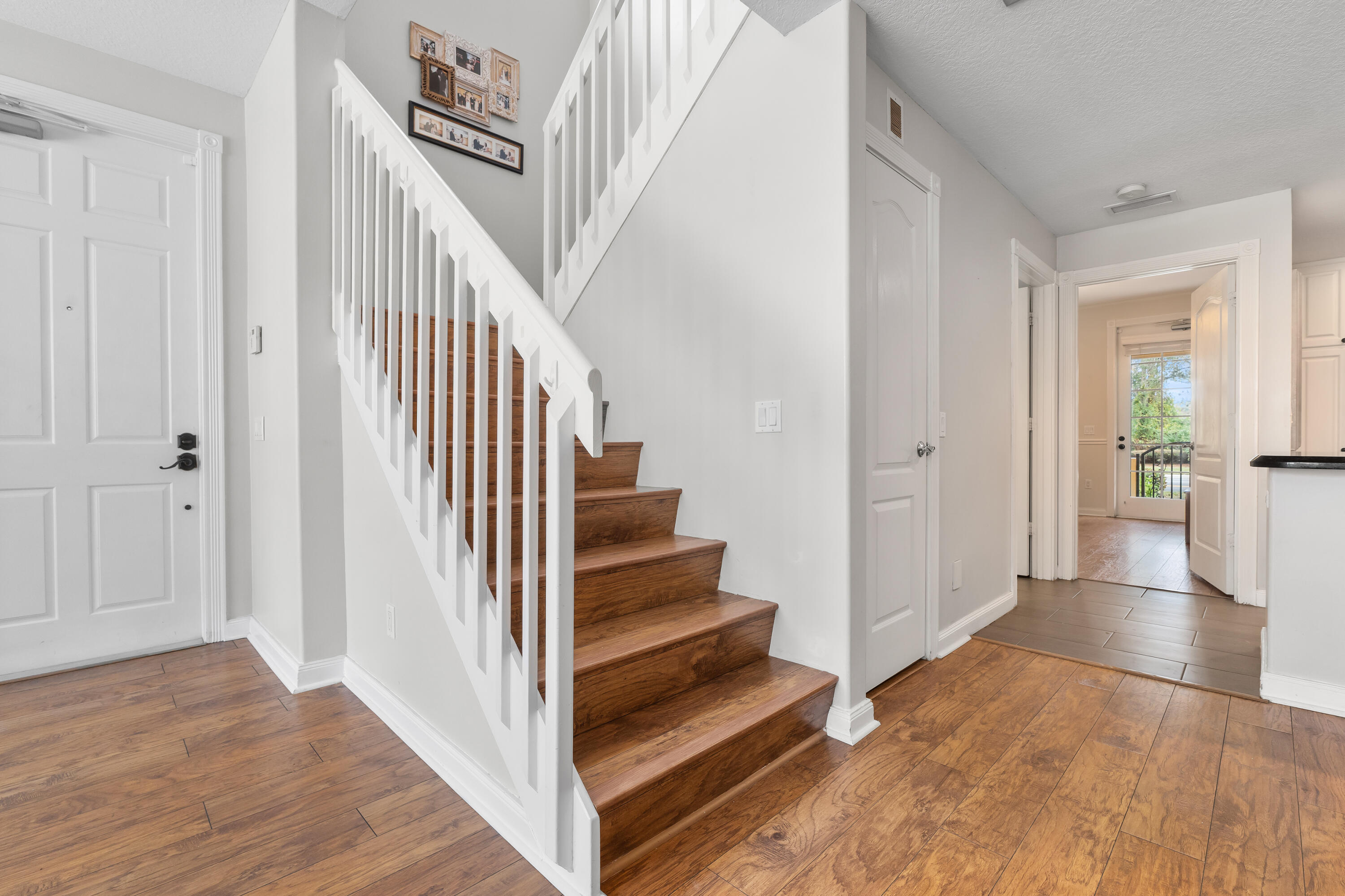 4050 Parkside Drive Jupiter, FL 33458 - Photo 16 of 59 a view of a hallway with wooden floor and entryway