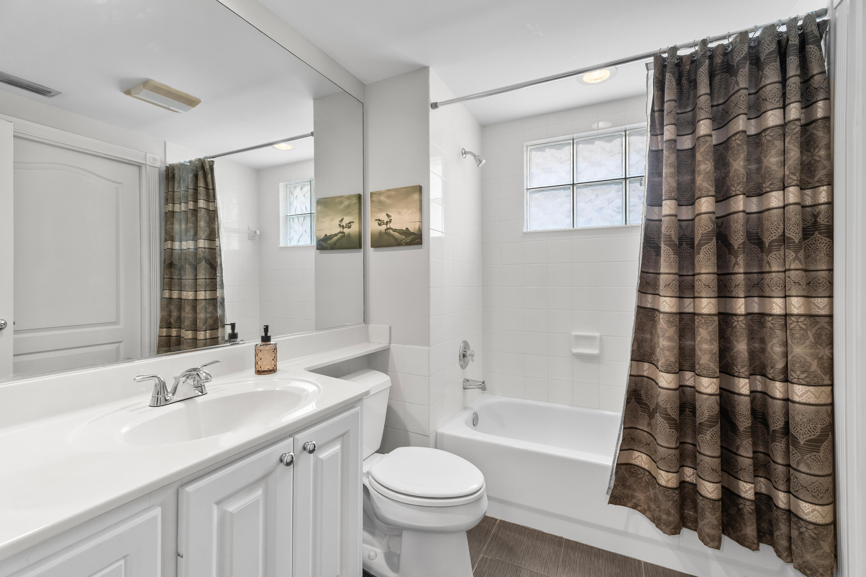 4050 Parkside Drive Jupiter, FL 33458 - Photo 23 of 59 a bathroom with a sink toilet and shower