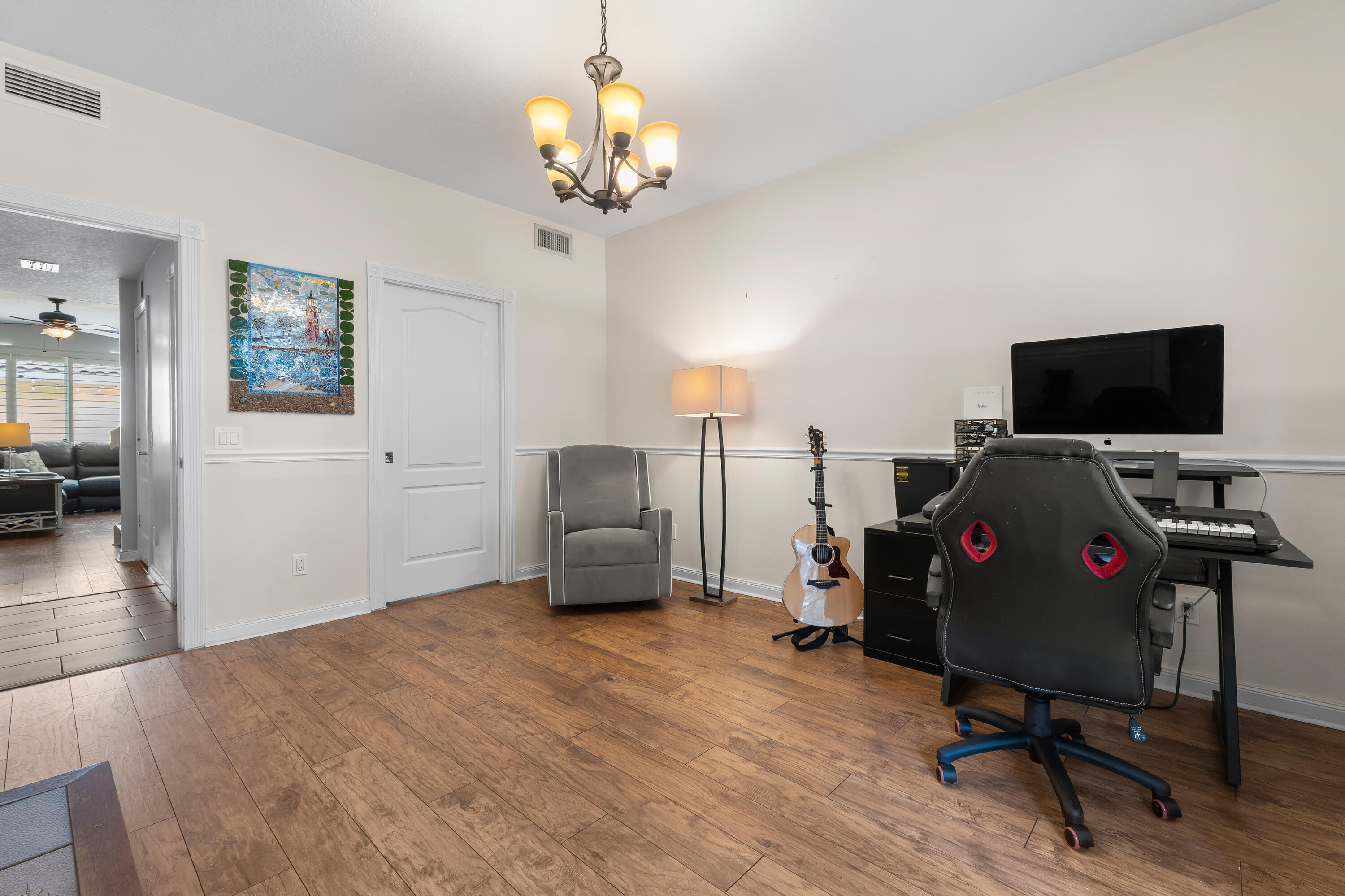 4050 Parkside Drive Jupiter, FL 33458 - Photo 26 of 59 a view of a livingroom with workspace and a window