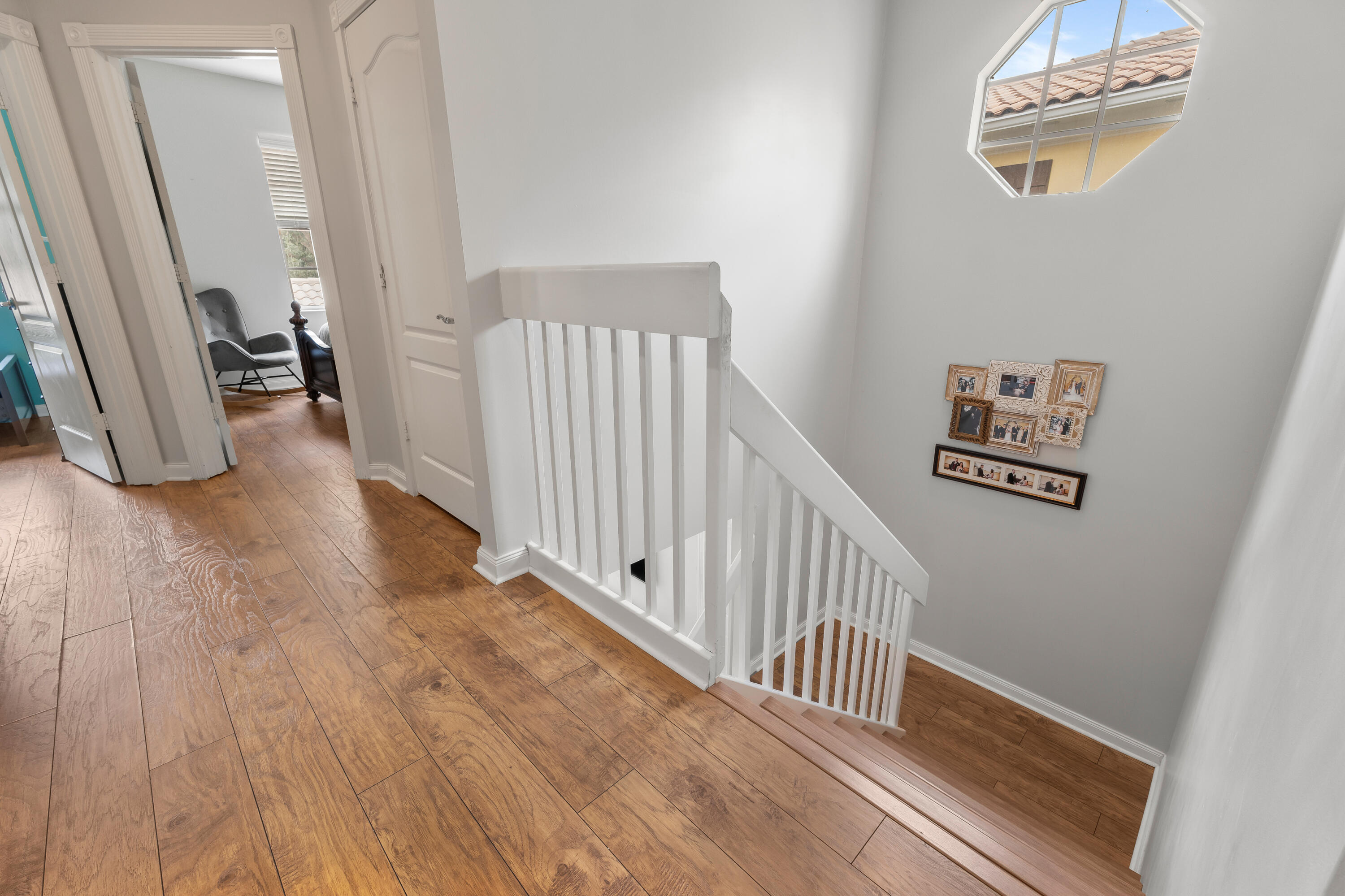 4050 Parkside Drive Jupiter, FL 33458 - Photo 28 of 59 a view of a hallway with wooden floor