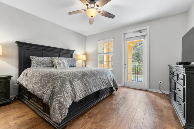 a bathroom with a toilet a sink a tub and mirror