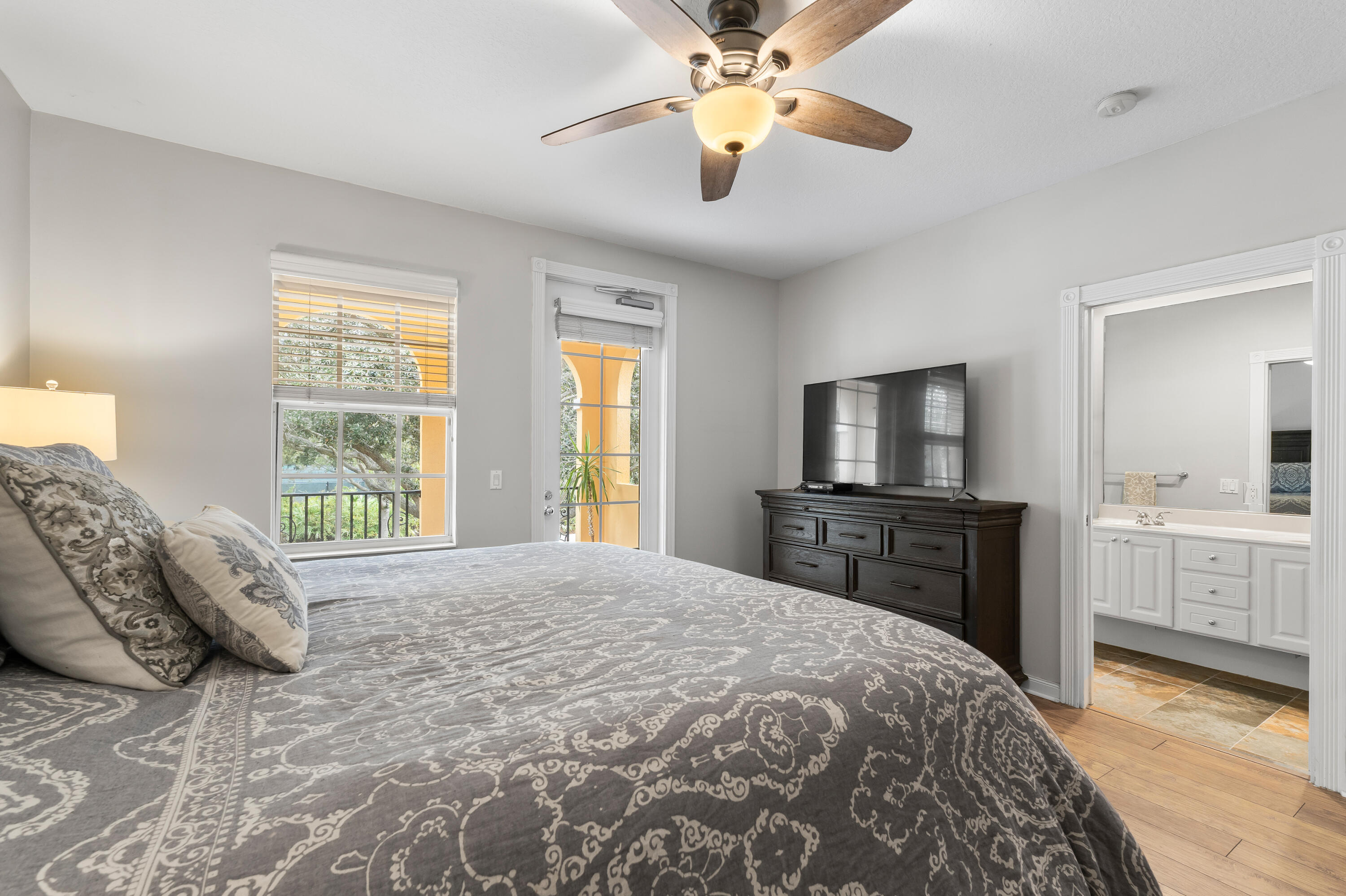 4050 Parkside Drive Jupiter, FL 33458 - Photo 30 of 59 a bedroom with a bed and a flat screen tv