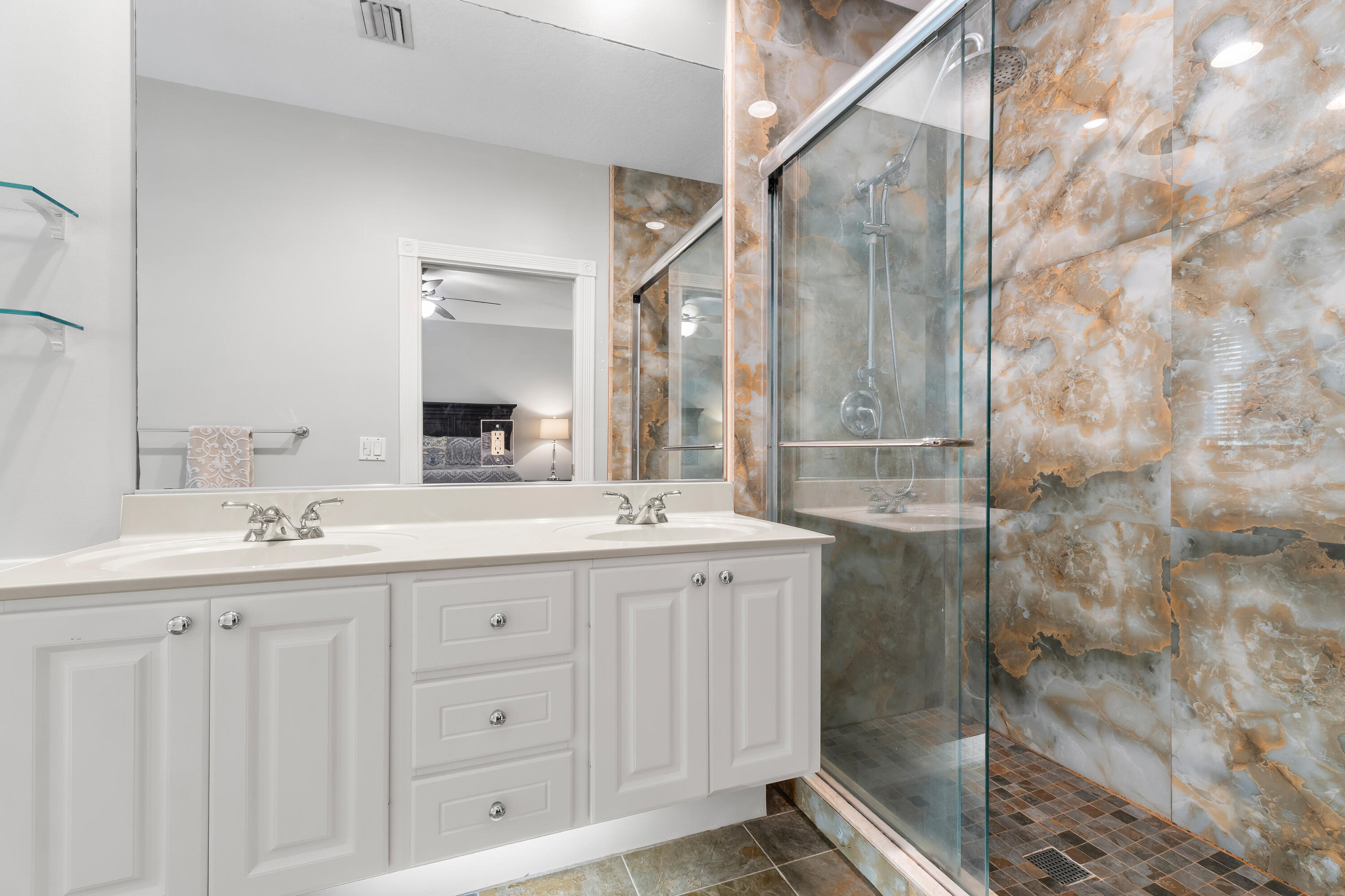 4050 Parkside Drive Jupiter, FL 33458 - Photo 32 of 59 a bathroom with a double vanity sink and mirror