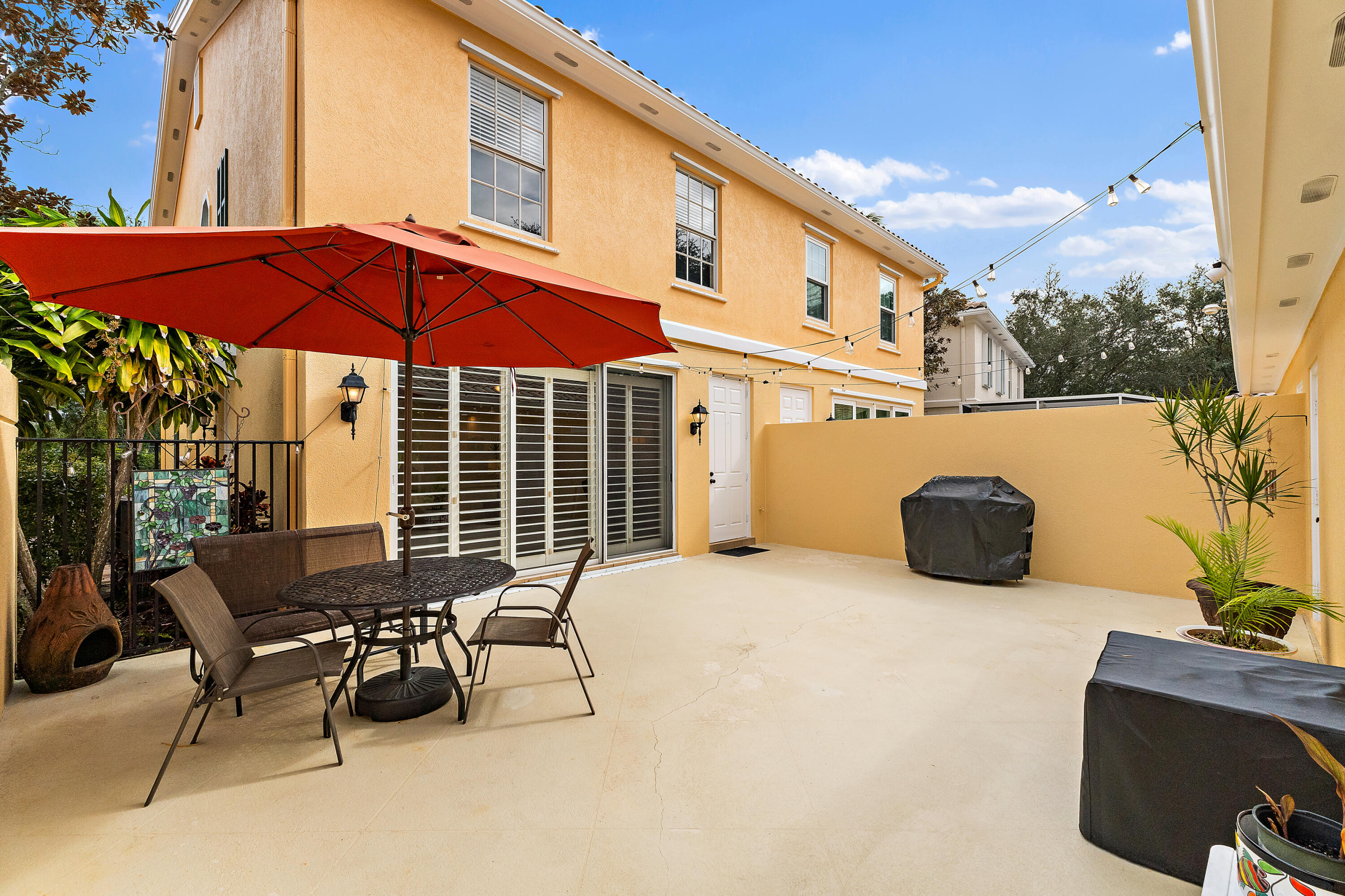 4050 Parkside Drive Jupiter, FL 33458 - Photo 45 of 59 a view of a chairs and table in the patio