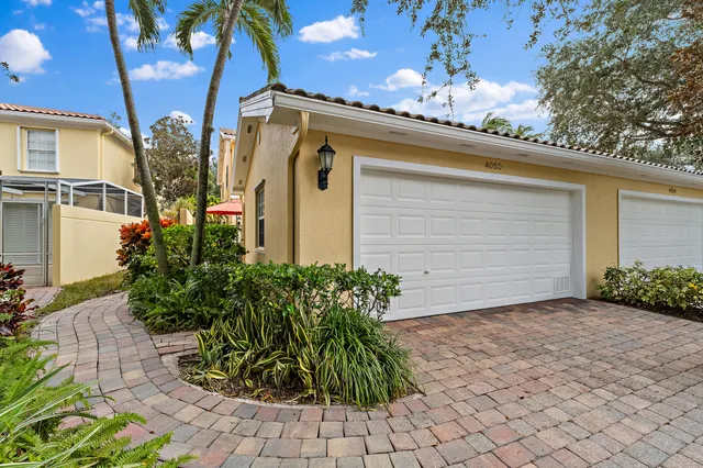 an aerial view of a residential houses with outdoor space and street view