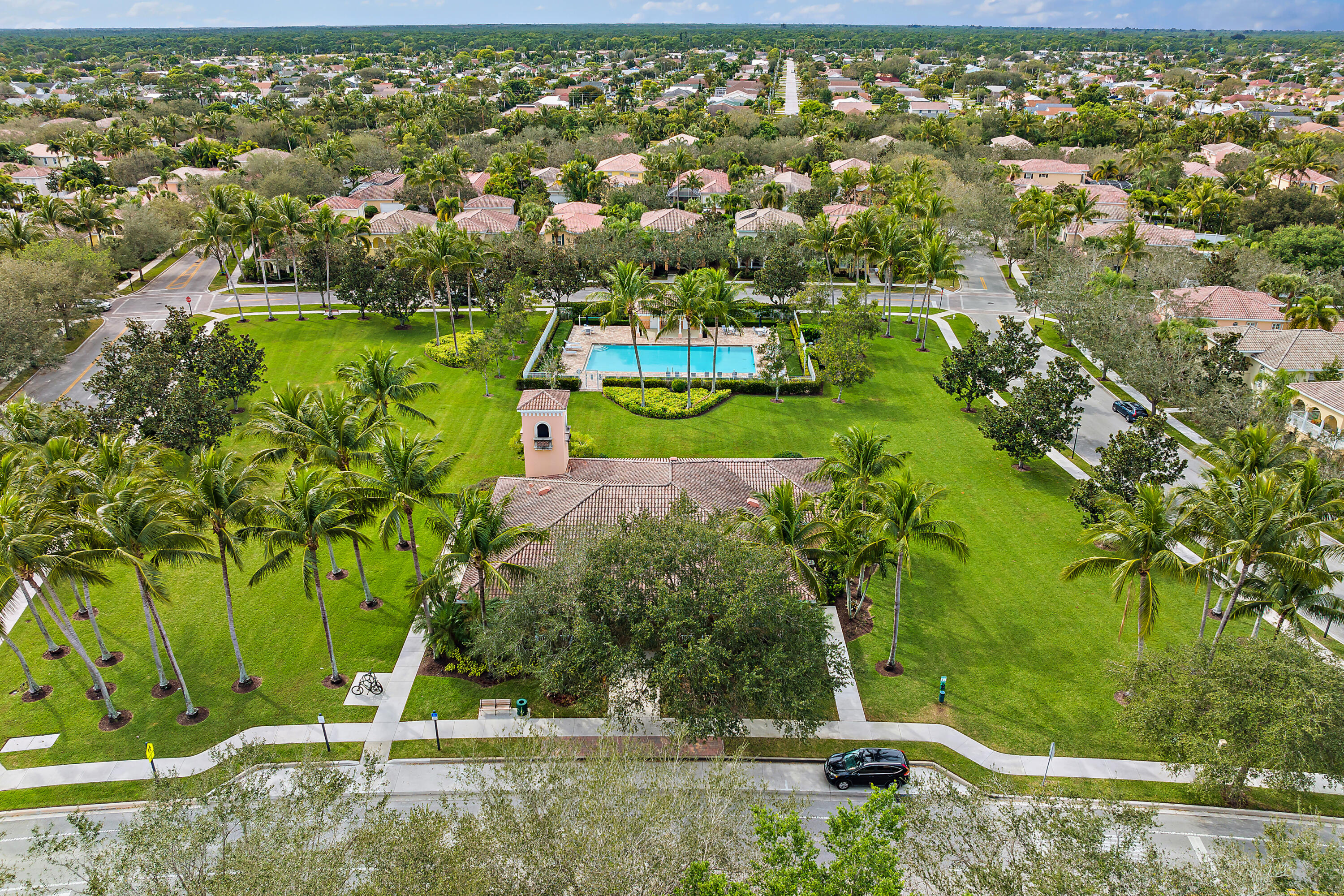 4050 Parkside Drive Jupiter, FL 33458 - Photo 55 of 59 an aerial view of residential houses with outdoor space and trees