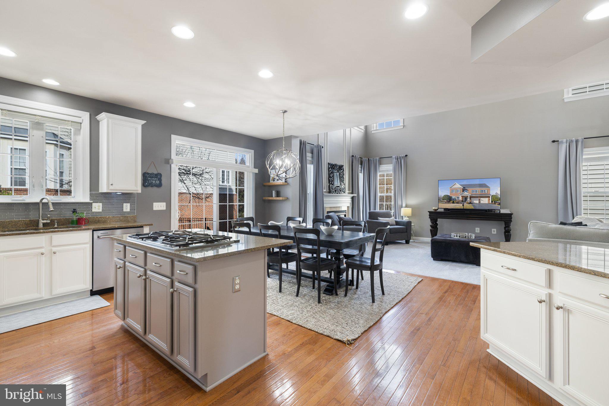 42624 Emperor Ashburn, VA 20148 - Photo 14 of 56 a kitchen with stainless steel appliances granite countertop wooden floors and stove