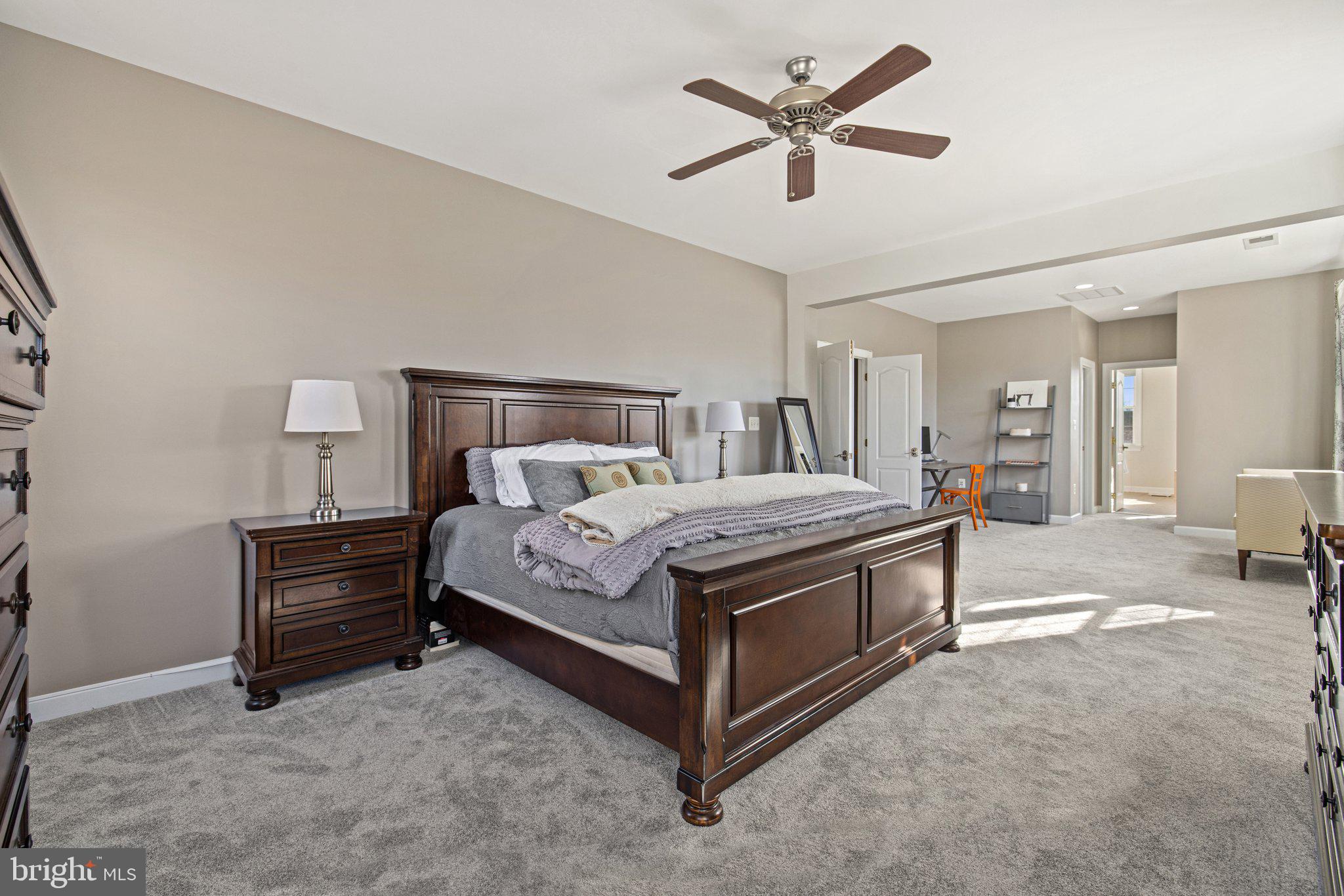 42624 Emperor Ashburn, VA 20148 - Photo 23 of 56 a bed room with a bed and a chandelier