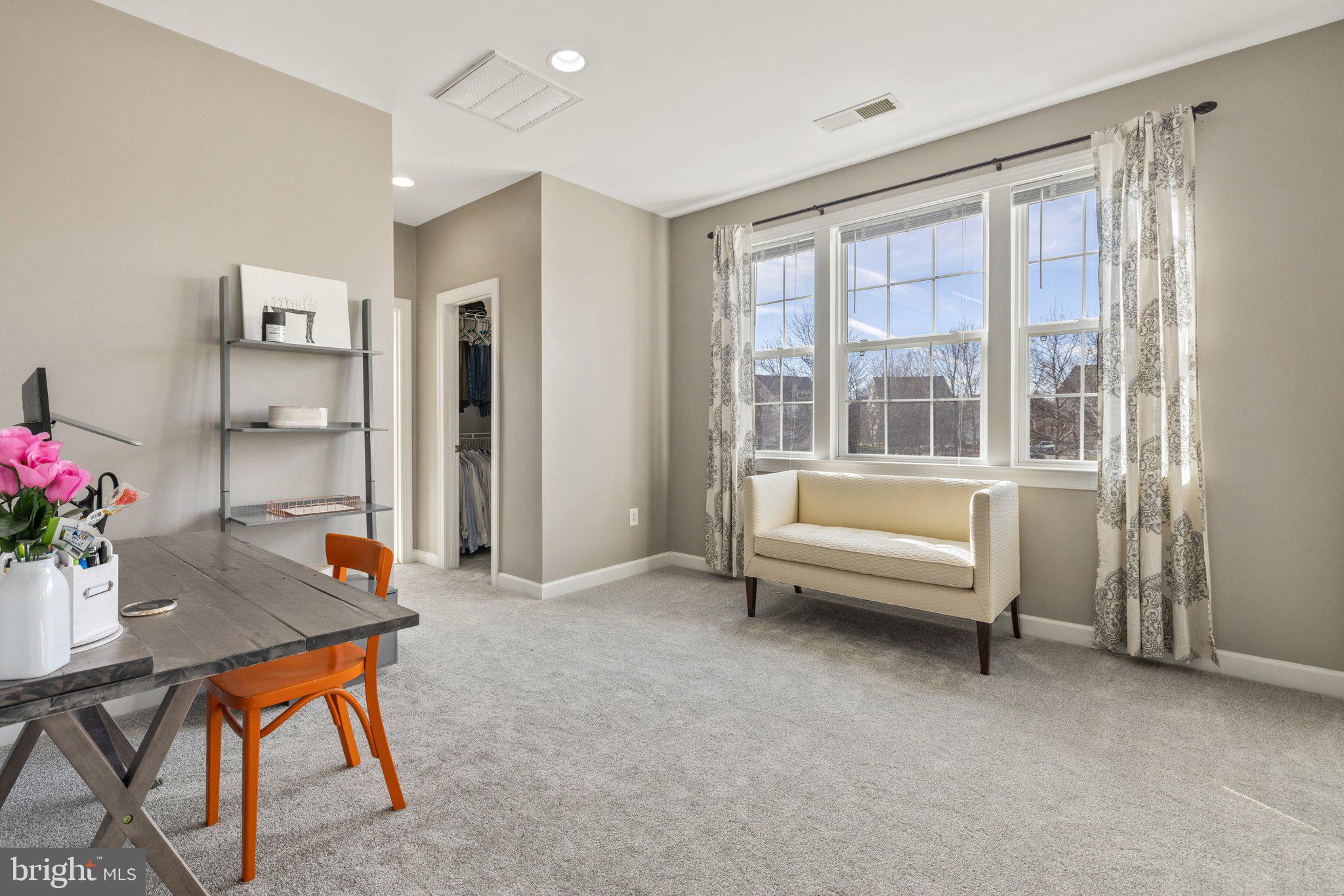 42624 Emperor Ashburn, VA 20148 - Photo 26 of 56 a living room with furniture and a potted plant
