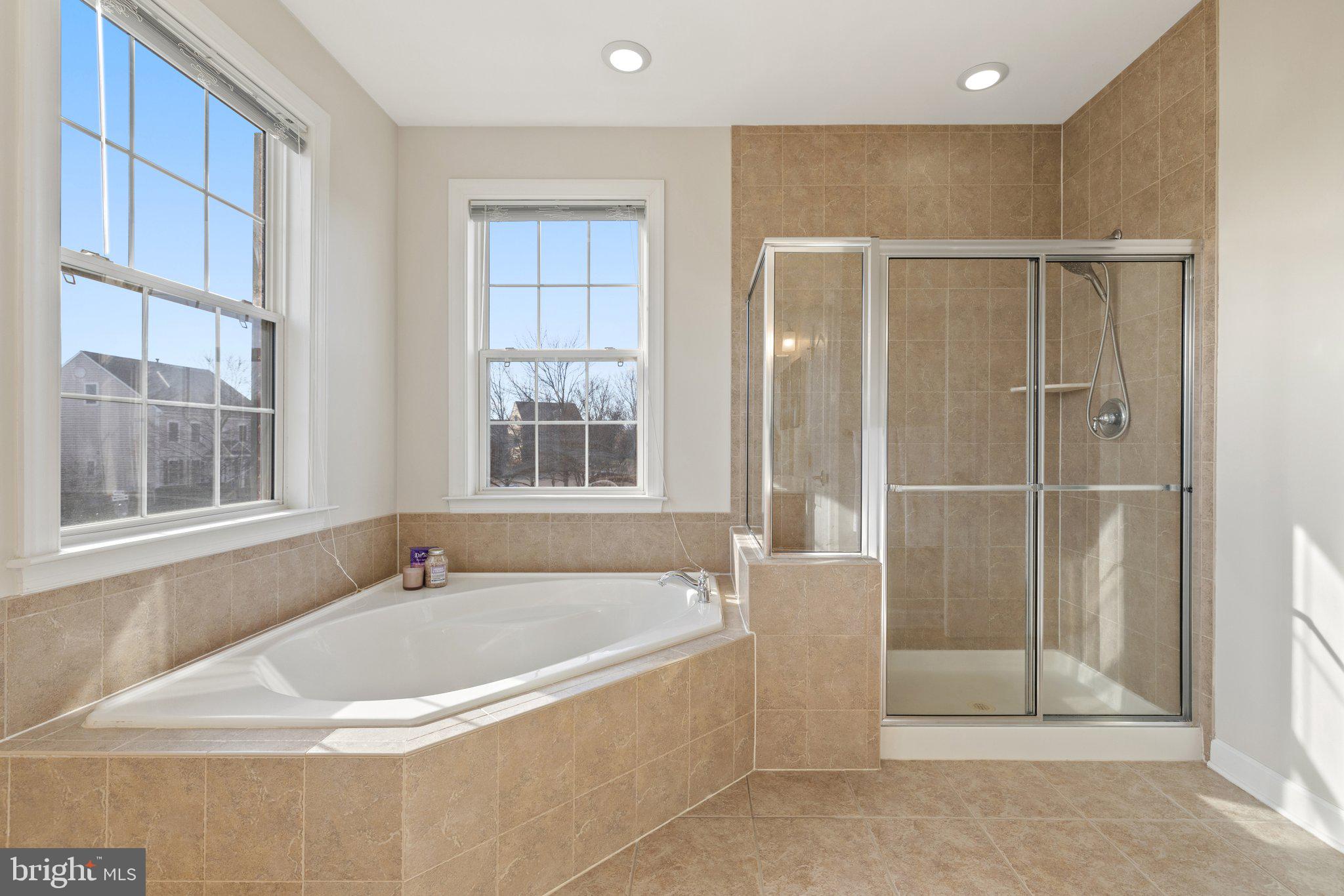 42624 Emperor Ashburn, VA 20148 - Photo 28 of 56 a bathroom with a tub and shower