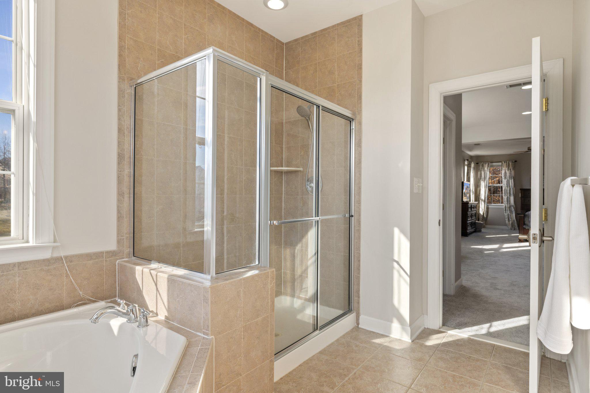 42624 Emperor Ashburn, VA 20148 - Photo 29 of 56 a bathroom with a bathtub and a shower