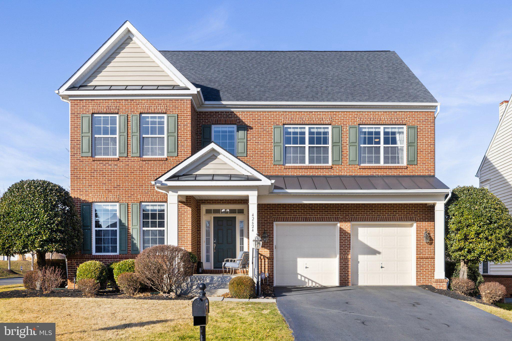 42624 Emperor Ashburn, VA 20148 - Photo 3 of 56 a front view of a house with a yard
