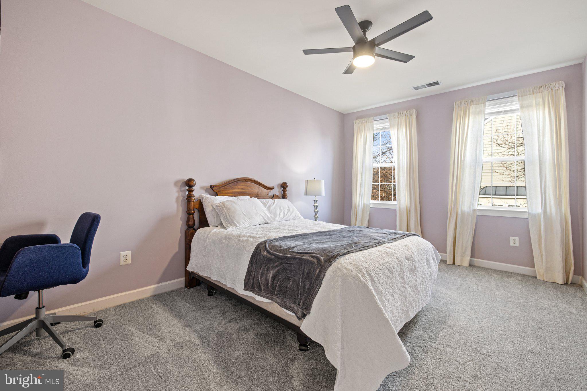 42624 Emperor Ashburn, VA 20148 - Photo 32 of 56 a bedroom with a bed a chair and a large window