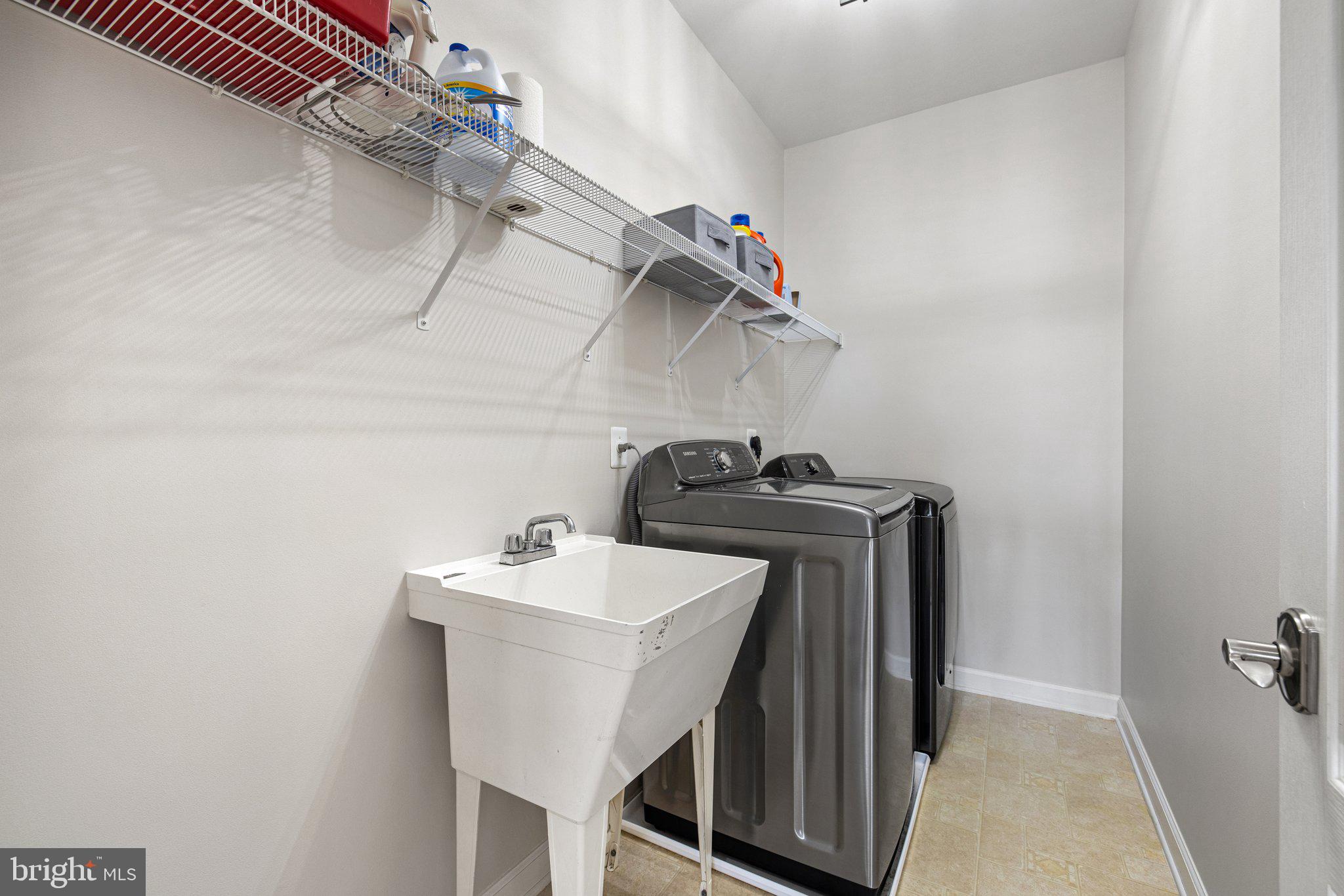 42624 Emperor Ashburn, VA 20148 - Photo 36 of 56 a utility room with dryer and washer
