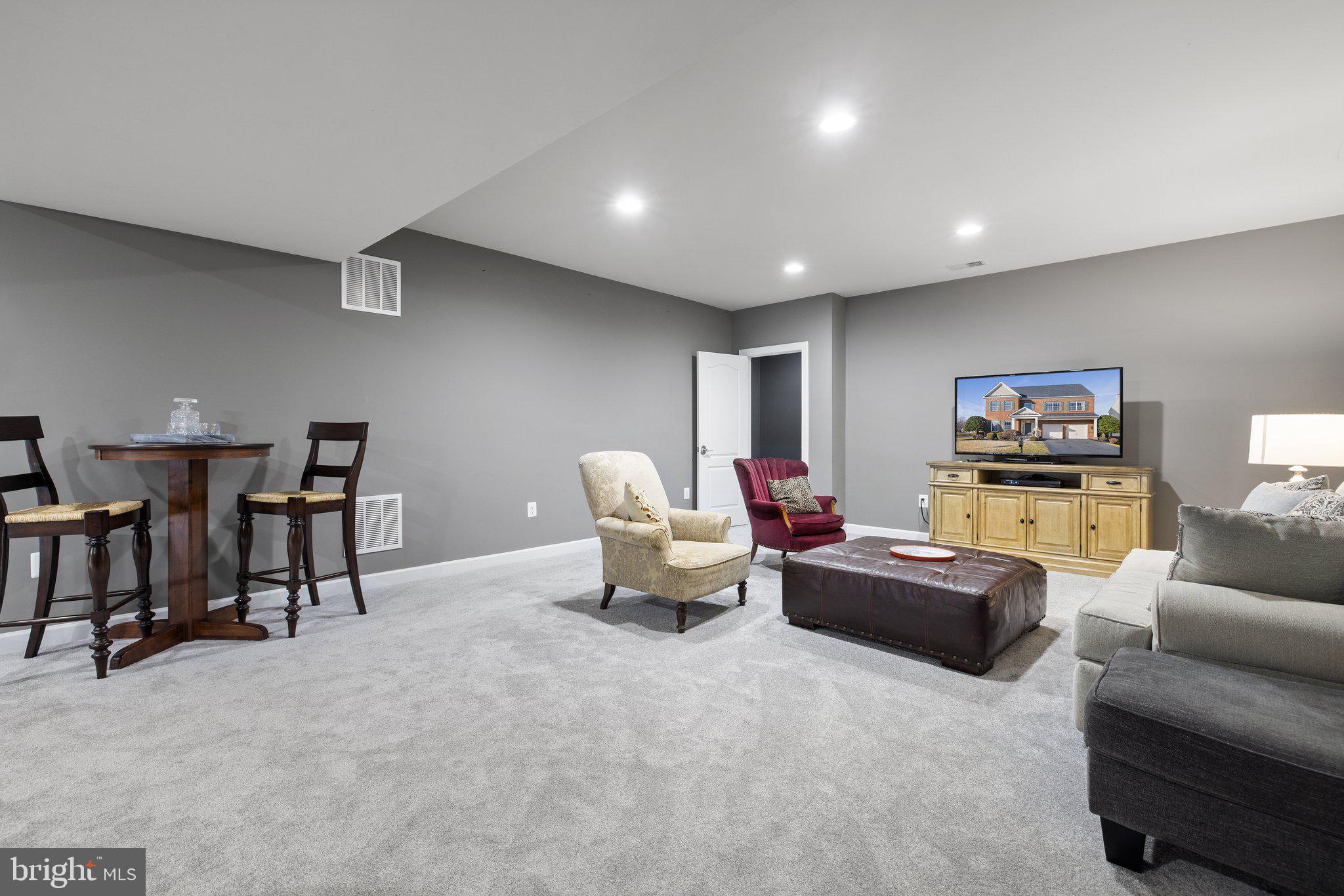 42624 Emperor Ashburn, VA 20148 - Photo 38 of 56 a living room with furniture and a flat screen tv