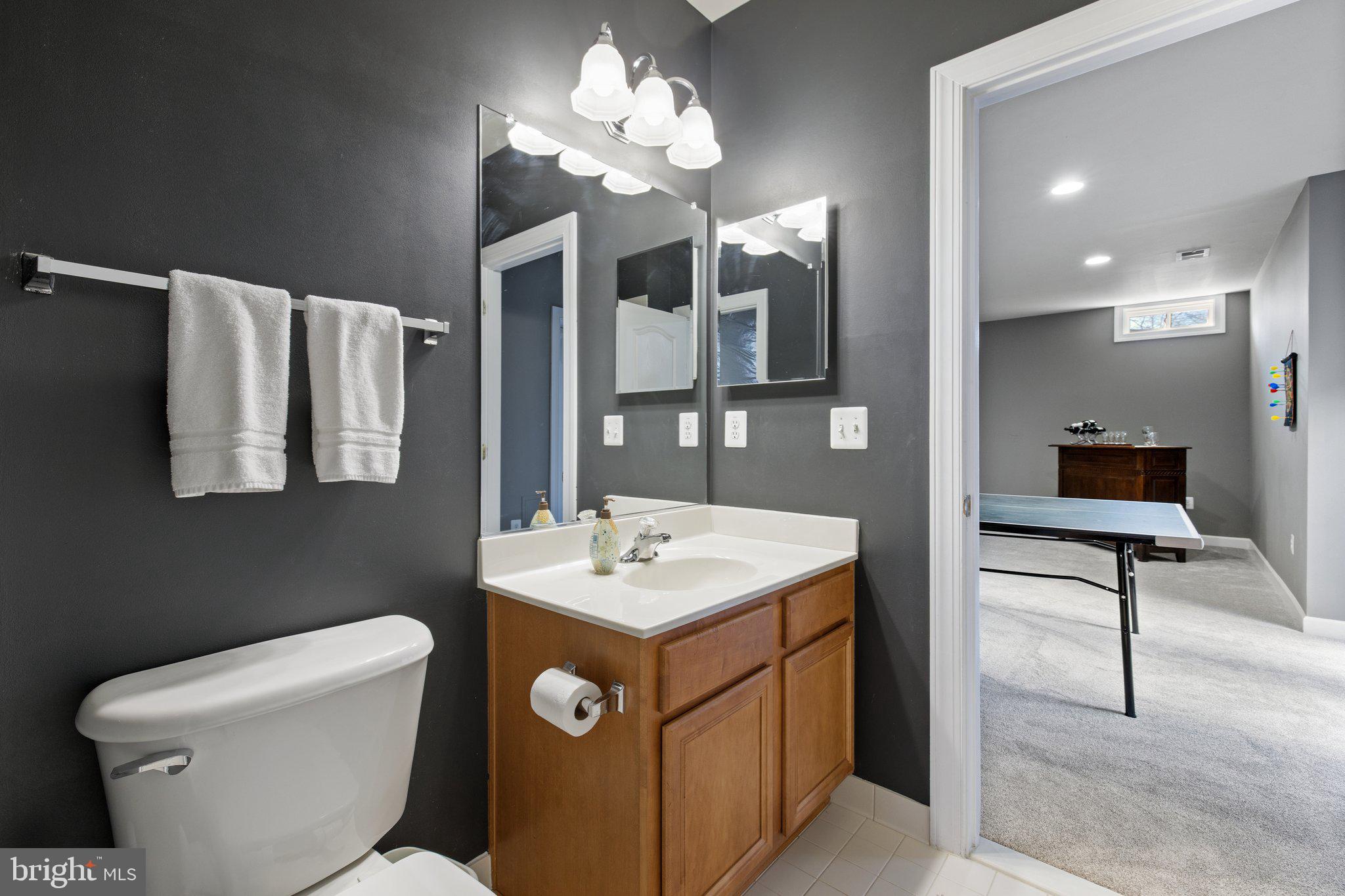42624 Emperor Ashburn, VA 20148 - Photo 41 of 56 a bathroom with a toilet sink and mirror