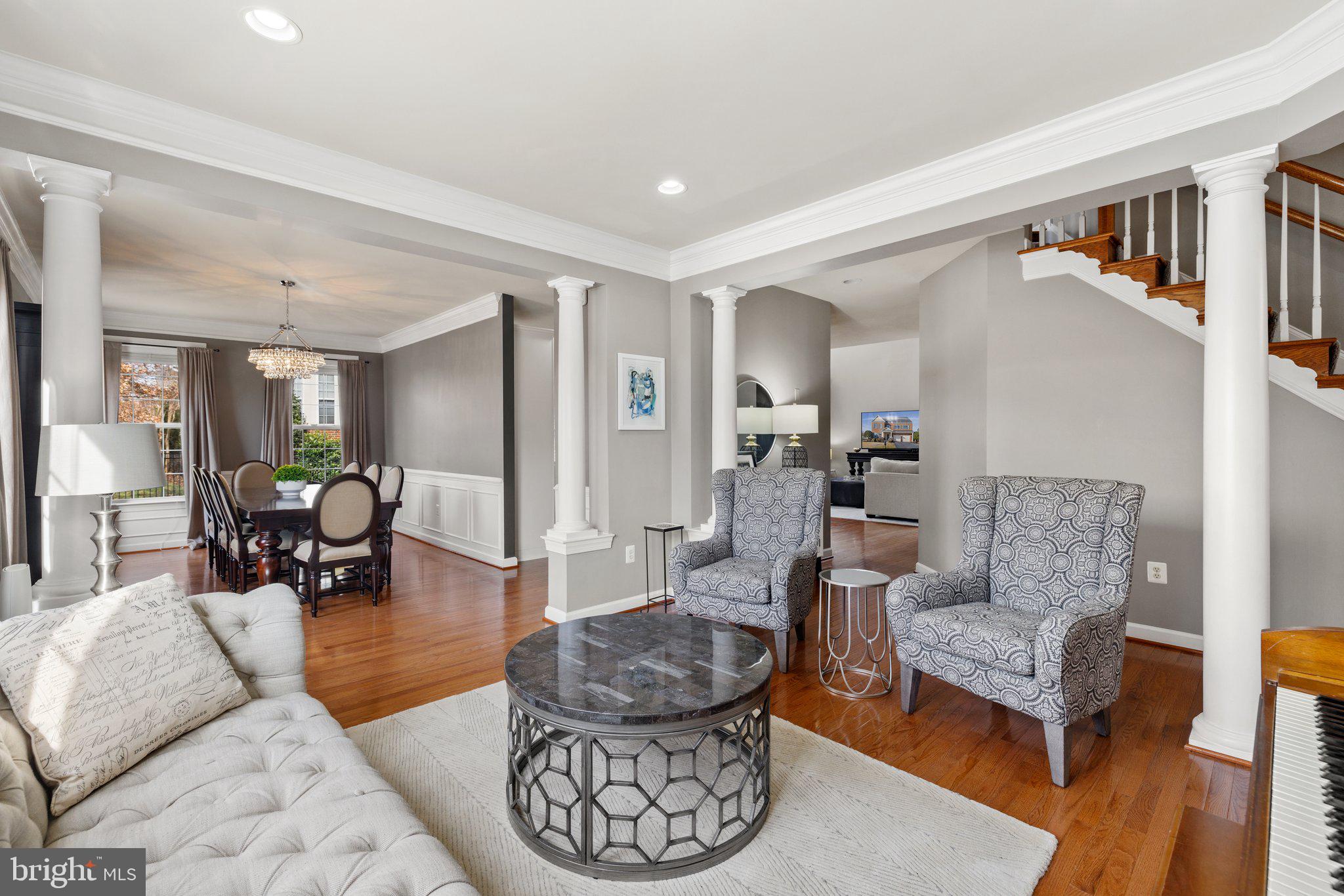 42624 Emperor Ashburn, VA 20148 - Photo 9 of 56 a living room with furniture and a dining table with wooden floor