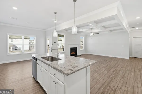 a kitchen with sink and window
