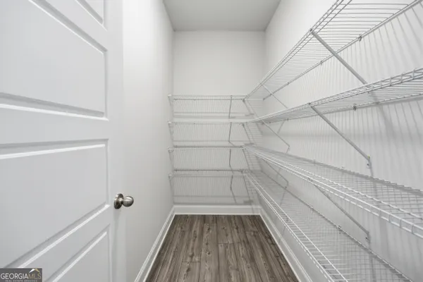 a view of a room with racks on the wall