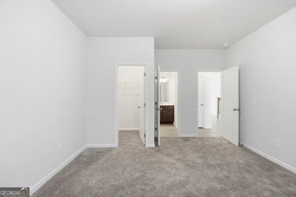 an empty room with a bathroom