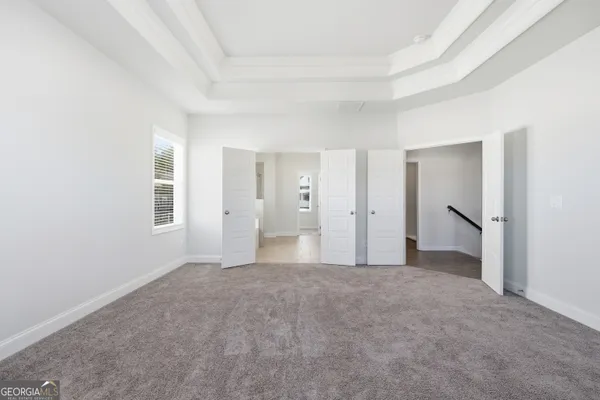 a view of empty room with a fireplace